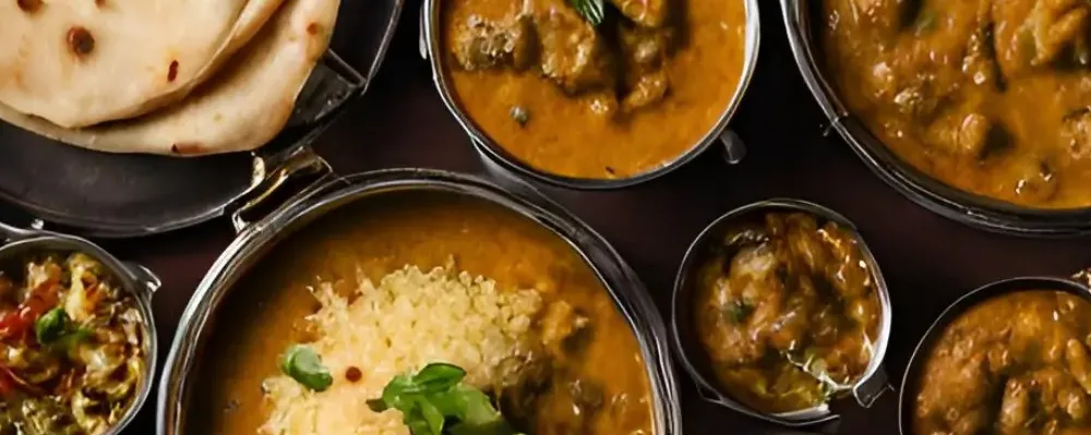 Explore Sydney in Style - Travelling Planet Earth Food Travel Page - featuring a table of Indian Food